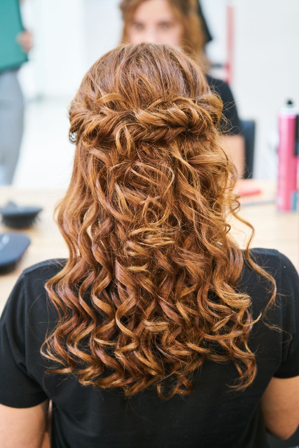 Long red curls seen from behind