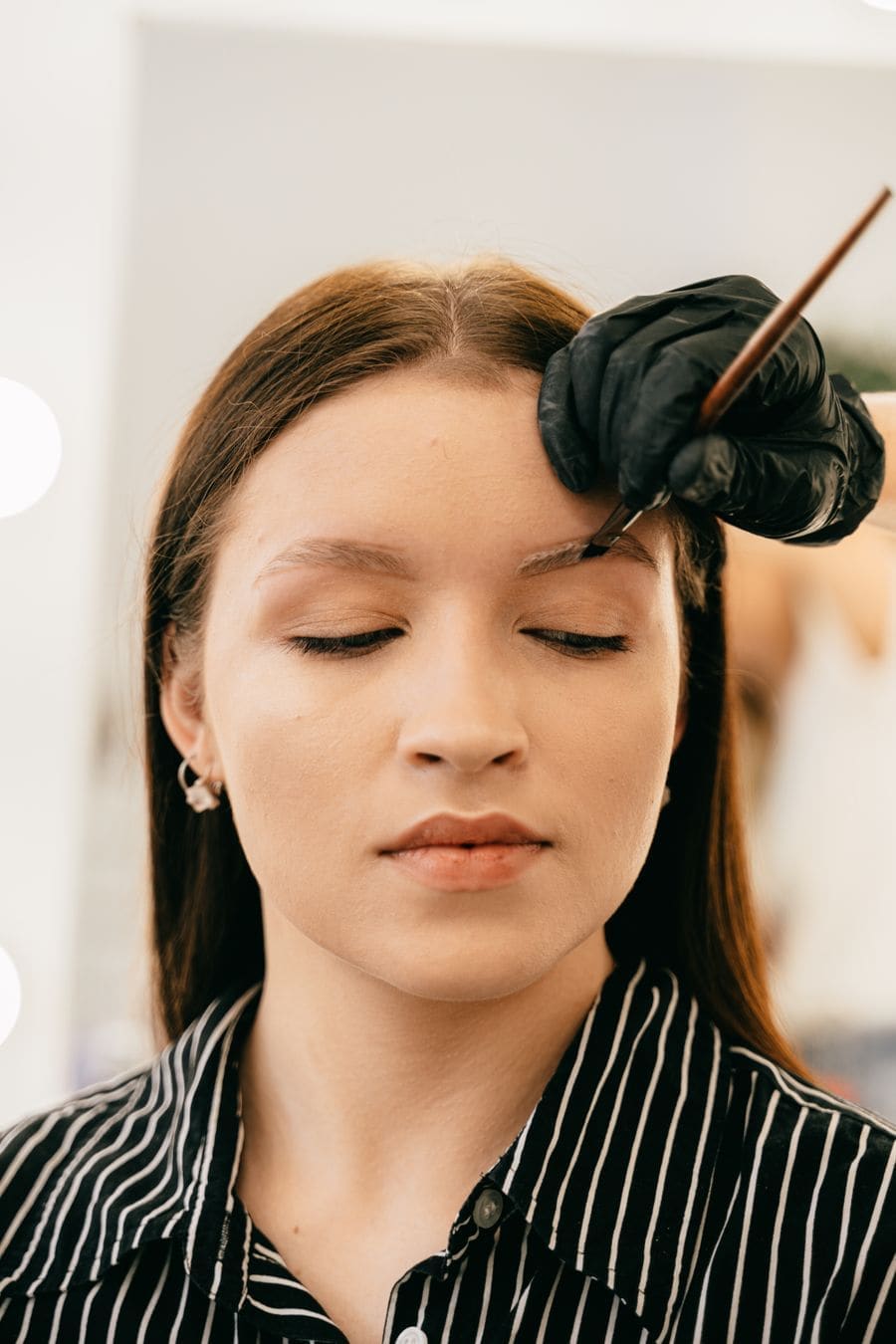 A woman with softly shaped, natural brows