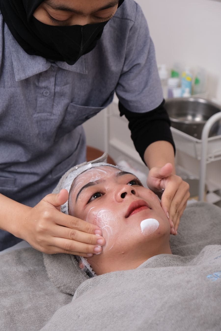 A client relaxing during a facial