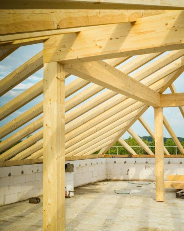 New timber roof framing over a second storey, open to the sky