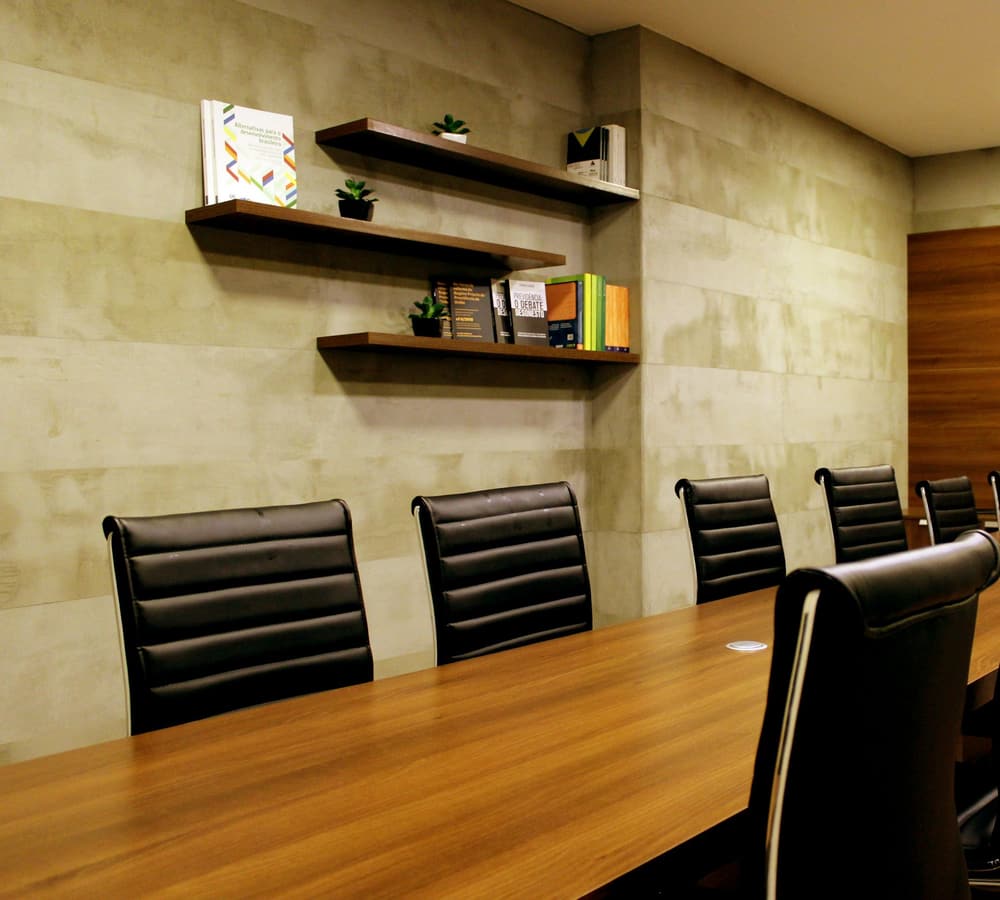 An empty meeting room with a table and chairs