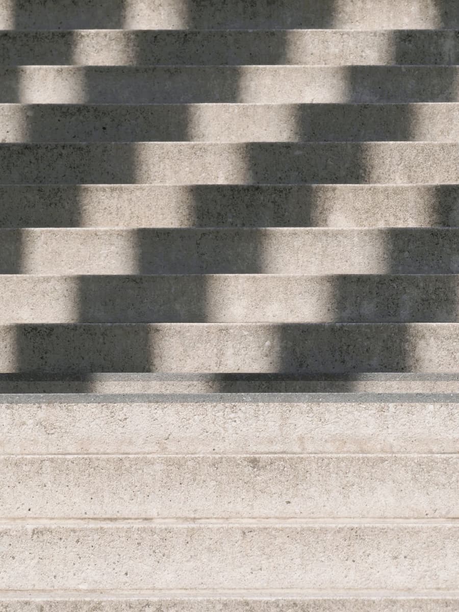 Sunlight and shadow falling across wide stone steps